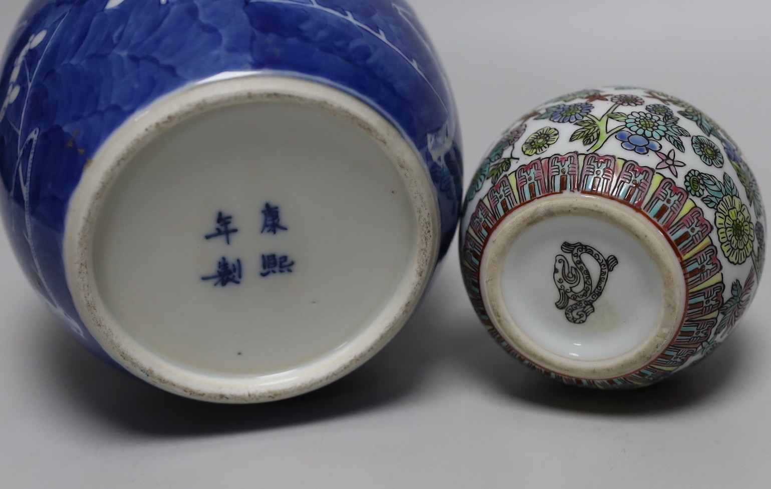 A 19th century Chinese famille rose box and cover, a blue and white prunus jar, two other jars, a figural brush rest and a cloisonne enamel dish